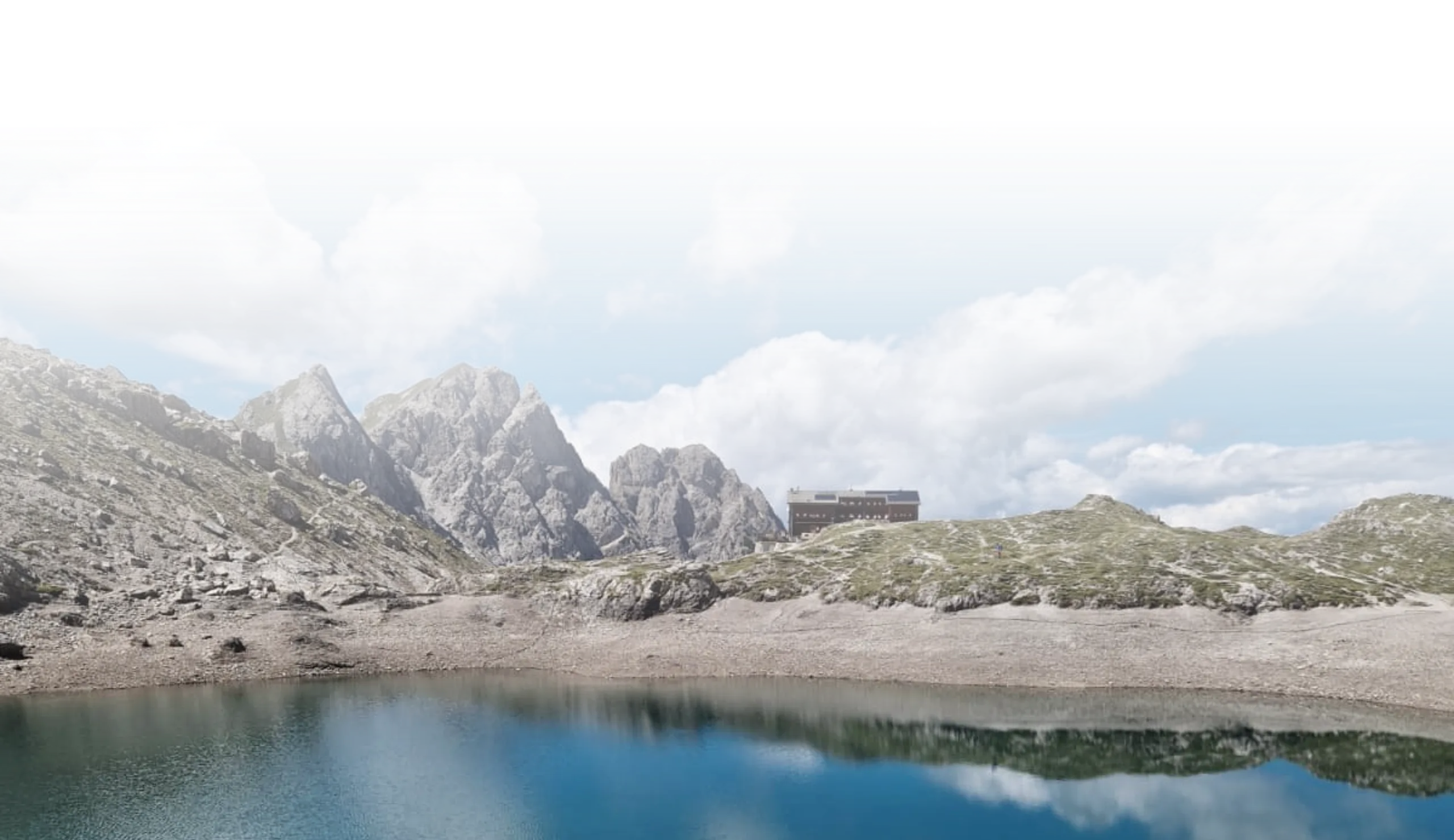 Felsige Berglandschaft mit Wolken und einem Bergsee
